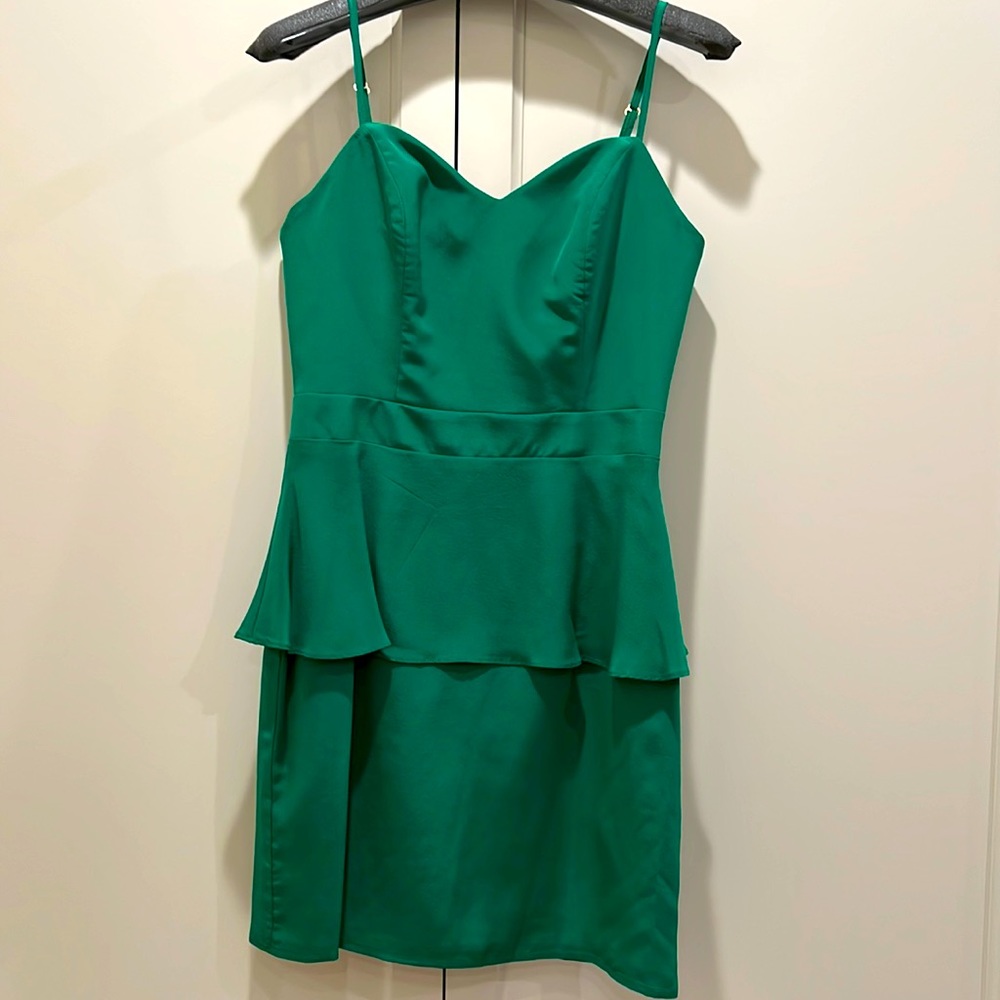 Naven, size 6, emerald green spaghetti strap mini with pendulum around waist.